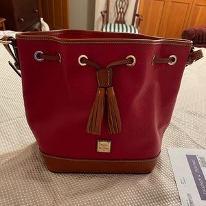 Dooney&B Pebble Grain Drawstring, red w/Vachetta trim. Has Registration
